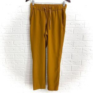 Lululemon On the Fly 7/8 Pant *Woven Fools Gold Size 4